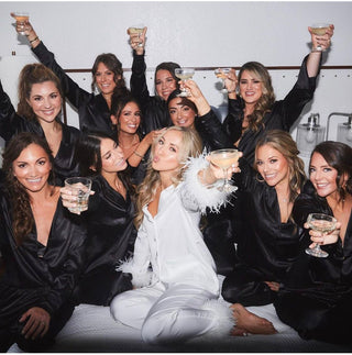 Hen Party Themes 2026: Bridesmaids celebrating with cocktails at a stylish hen party gathering.