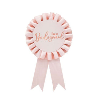 Rose gold circular badge with "I'm a Bridesmaid" text, ideal for hen parties and bridal celebrations.