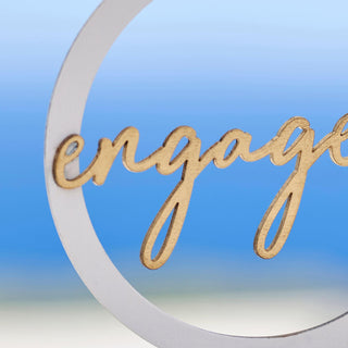 Wooden engagement ring cake topper with silver ring base and gold 'Engaged' script â€“ ideal for wedding cakes