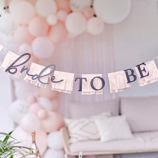 'Bride To Be' bunting with elegant lettering and tassel garland, ideal for hen party decorations.