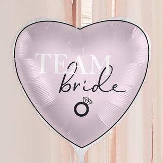 Pink heart-shaped foil balloon with 'Team Bride' lettering, ideal for hen party decorations.